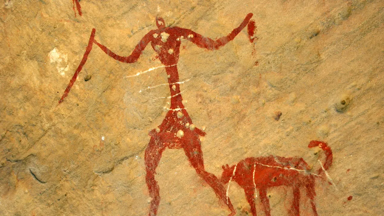 libyan_rock_art_7k_years_old_hunter_and_dog.webp
